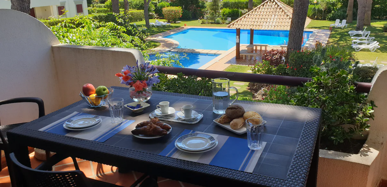 Private terrace at Pé no Mar & Golf overlooking the Solar do Golf condominium pools and gardens.