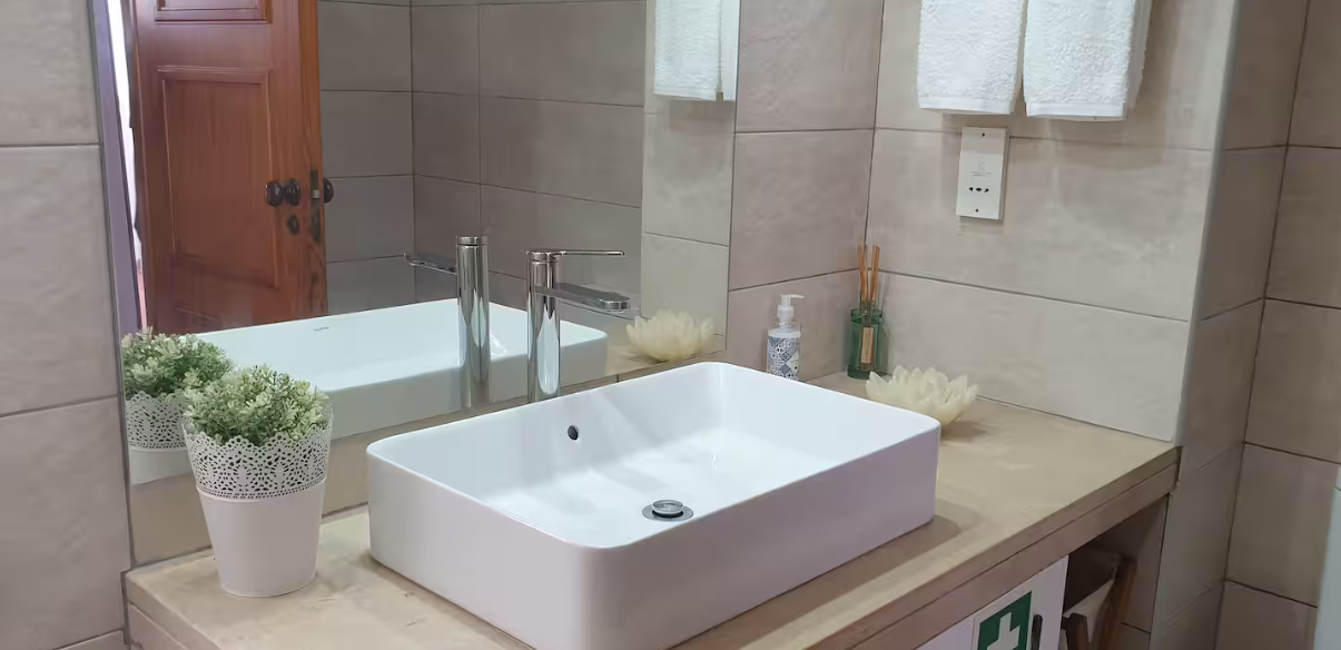 Bathroom with private bath, large shower and natural light.